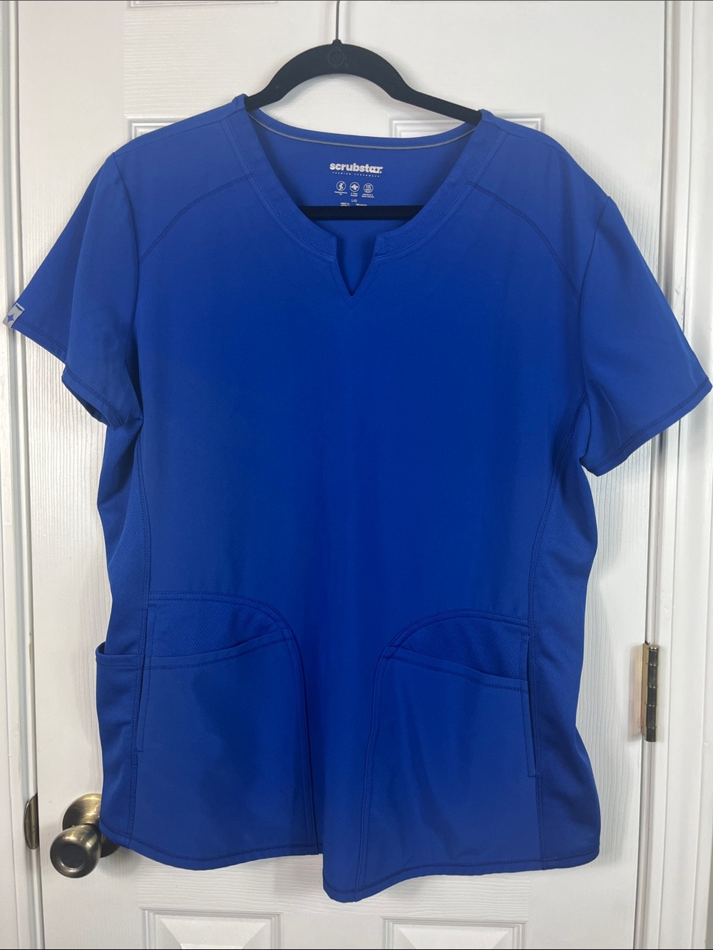 Scrub Star Royal blue short sleeved scrub top size large. 2 pockets.